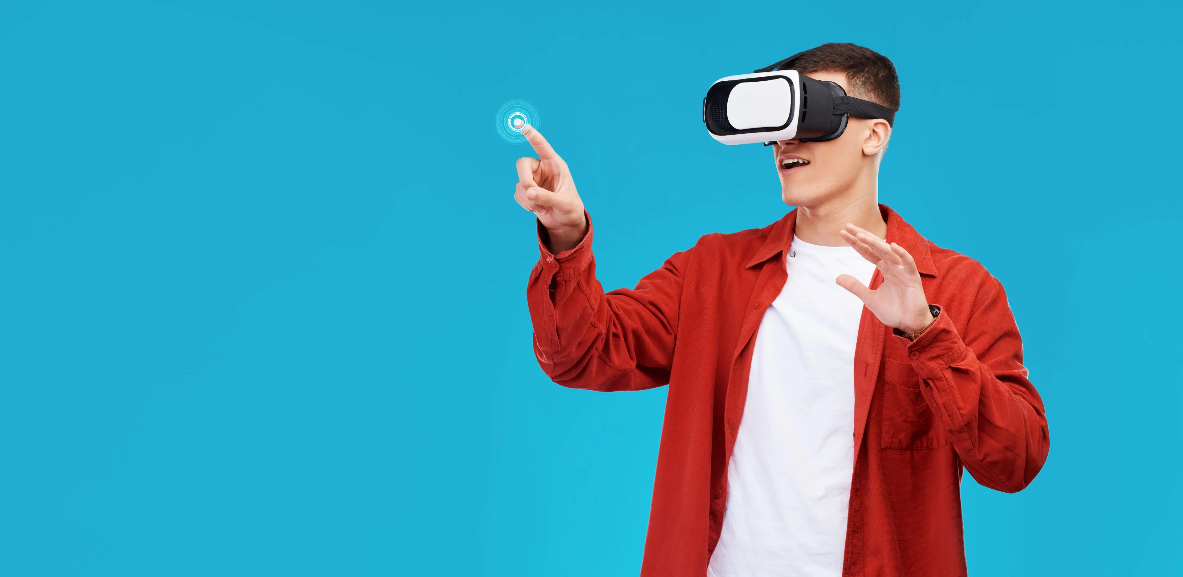 Man, press and VR or futuristic glasses for education, 3d software or gaming in studio metaverse. Student in virtual reality, touch glow and fingerprint hologram on a blue background and banner space Man, press and VR or futuristic glasses for education, 3d software or gaming in studio metaverse. Student in virtual reality, touch glow and fingerprint hologram on a blue background and banner space